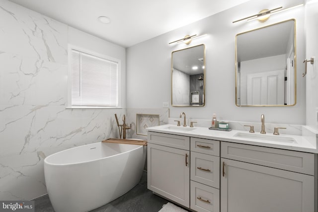 25146 Mineral Springs Cir, Aldie, VA 20105 - full bath featuring double vanity, a soaking tub, and tile walls