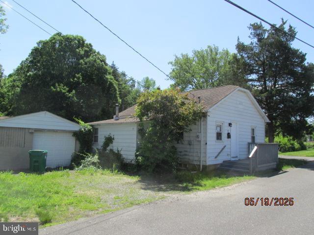 8 Pine St, New Egypt, NJ 08533 - view of side of property with a garage and an outbuilding