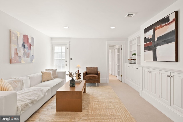 2314 20th St NW, Washington, DC 20009 - living area featuring light colored carpet, recessed lighting, and built in shelves