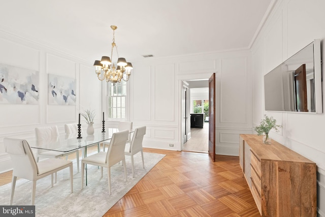 2314 20th St NW, Washington, DC 20009 - dining room featuring a decorative wall, a chandelier, and crown molding