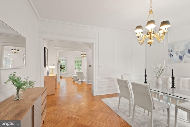 2314 20th St NW, Washington, DC 20009 - dining space featuring a chandelier, a decorative wall, and crown molding