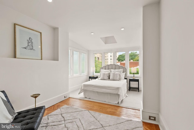 2314 20th St NW, Washington, DC 20009 - bedroom featuring baseboards, multiple windows, lofted ceiling, recessed lighting, and wood finished floors