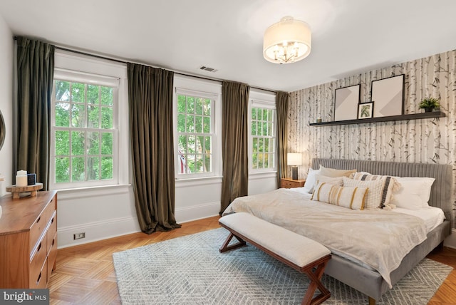 2314 20th St NW, Washington, DC 20009 - bedroom with multiple windows, wallpapered walls, baseboards, and a chandelier