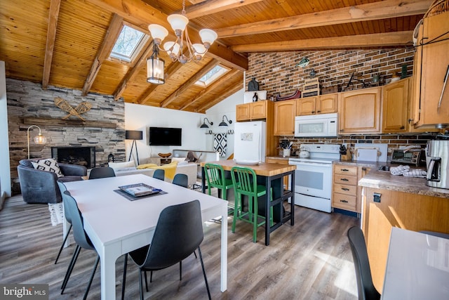 636 Paradise Hts, Oakland, MD 21550 - dining area with a skylight, wood finished floors, a stone fireplace, wooden ceiling with exposed beams, and high vaulted ceiling