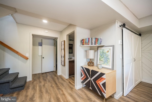 636 Paradise Hts, Oakland, MD 21550 - hallway featuring a barn door, wood finished floors, stairs, baseboards, and recessed lighting