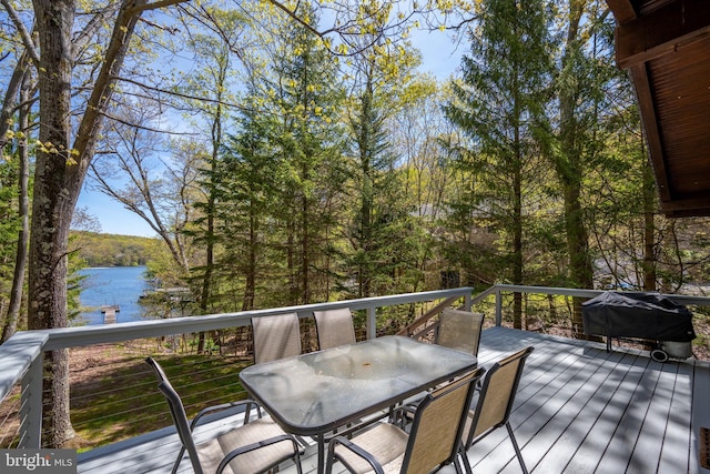 636 Paradise Hts, Oakland, MD 21550 - deck with outdoor dining area, a water view, and a wooded view