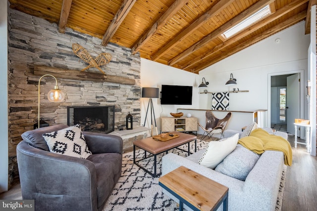 636 Paradise Hts, Oakland, MD 21550 - living area featuring wood finished floors, wooden ceiling with exposed beams, a stone fireplace, and high vaulted ceiling
