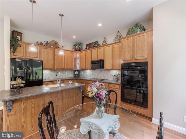 120 Whiteland Hills Cir, Exton, PA 19341 - kitchen with black appliances, a sink, dark countertops, decorative backsplash, and recessed lighting