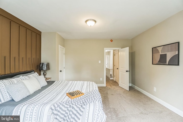 bedroom with carpet and baseboards