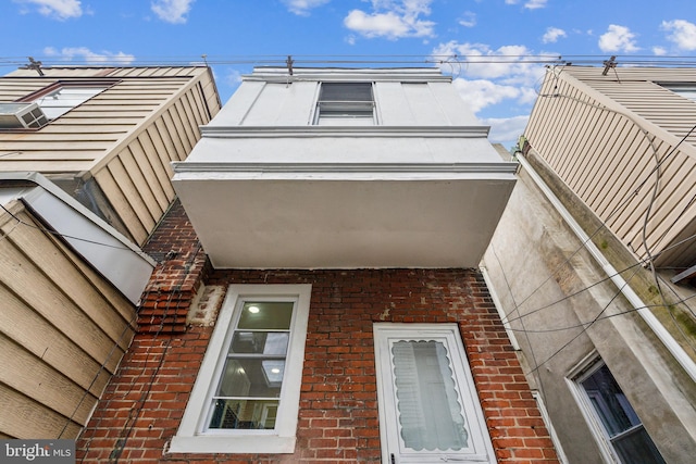 view of side of property with brick siding