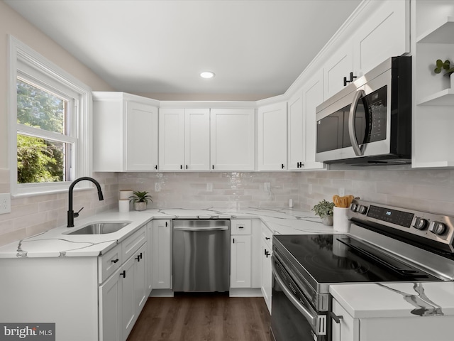 3817 Arbutus Ave, Baltimore, MD 21207 - kitchen featuring stainless steel appliances, a sink, white cabinetry, and light stone counters