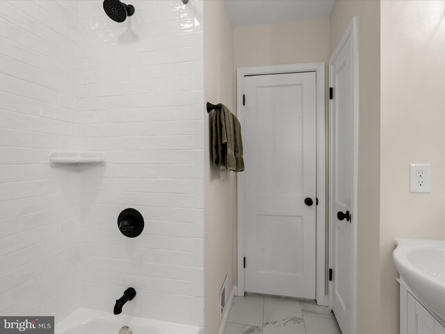 3817 Arbutus Ave, Baltimore, MD 21207 - full bathroom featuring marble look tiles, vanity, shower / bath combination, and baseboards