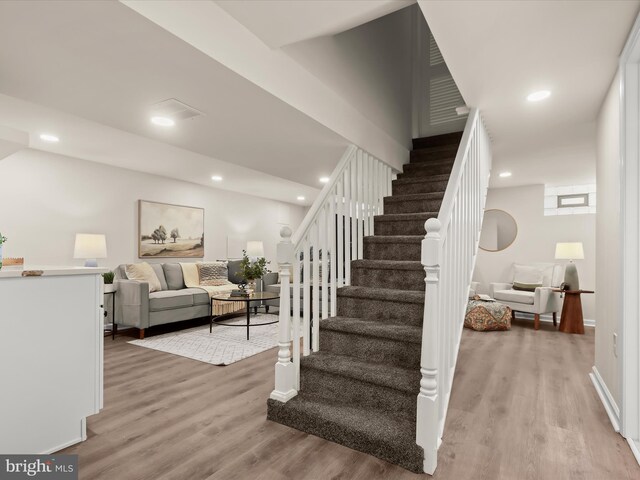 3817 Arbutus Ave, Baltimore, MD 21207 - stairs featuring wood finished floors, recessed lighting, and baseboards