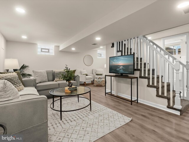 3817 Arbutus Ave, Baltimore, MD 21207 - living area with wood finished floors, baseboards, recessed lighting, and stairs