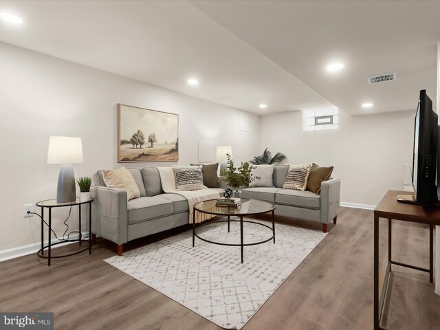 3817 Arbutus Ave, Baltimore, MD 21207 - living area featuring wood finished floors, baseboards, and recessed lighting