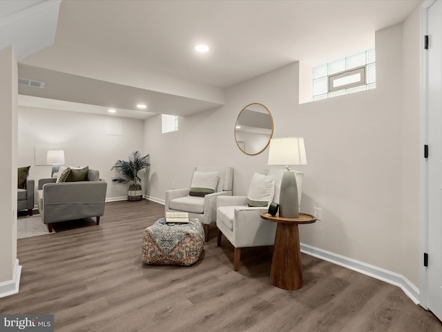 3817 Arbutus Ave, Baltimore, MD 21207 - living area with wood finished floors, baseboards, and recessed lighting
