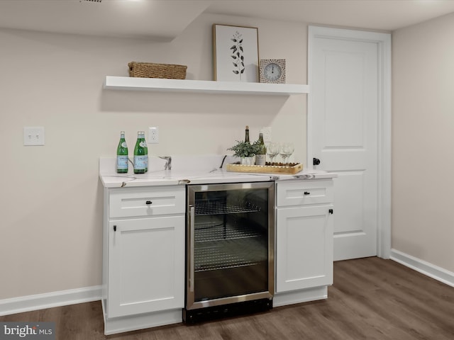 3817 Arbutus Ave, Baltimore, MD 21207 - indoor bar featuring wine cooler, baseboards, and dark wood-style floors