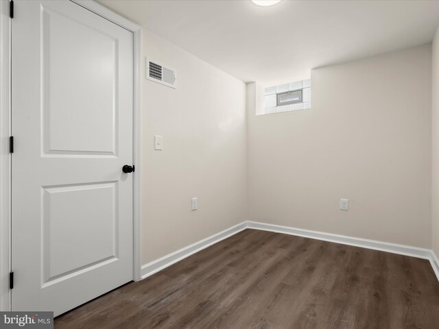 3817 Arbutus Ave, Baltimore, MD 21207 - spare room with dark wood-type flooring and baseboards