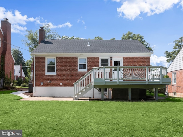 3817 Arbutus Ave, Baltimore, MD 21207 - rear view of house featuring brick siding, a lawn, a wooden deck, and a chimney