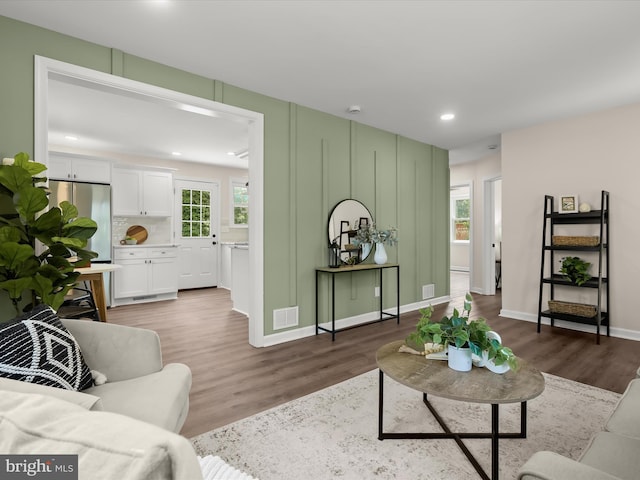 3817 Arbutus Ave, Baltimore, MD 21207 - living area featuring wood finished floors, recessed lighting, and baseboards