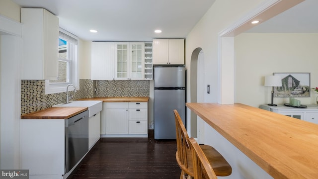 409 W 10th Ave, Conshohocken, PA 19428 - kitchen with butcher block counters, appliances with stainless steel finishes, a sink, dark wood-style flooring, and white cabinets