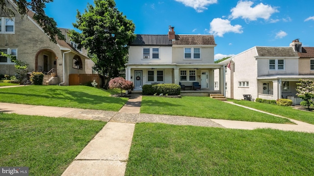 409 W 10th Ave, Conshohocken, PA 19428 - view of front of home with covered porch, a chimney, a front yard, and stucco siding