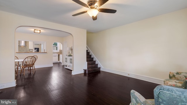 409 W 10th Ave, Conshohocken, PA 19428 - living room with a ceiling fan, wood finished floors, arched walkways, baseboards, and stairway