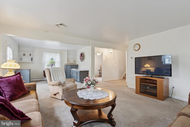 10 Mccarthy Ave, Langhorne, PA 19047 - living room featuring a baseboard heating unit, stairway, carpet, and baseboards