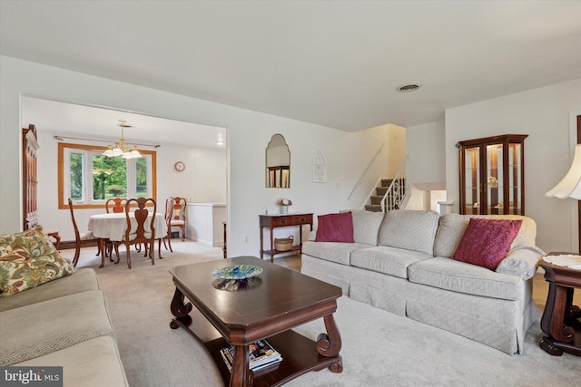 10 Mccarthy Ave, Langhorne, PA 19047 - carpeted living room featuring stairway and a chandelier