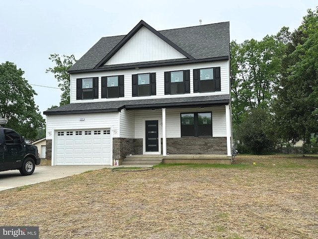 view of front of house with a porch, stone siding, an attached garage, driveway, and a shingled roof