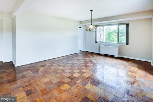 4201 Cathedral Ave NW Unit 1004E, Washington, DC 20016 - empty room featuring radiator heating unit and baseboards
