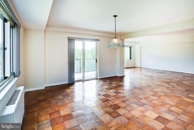 4201 Cathedral Ave NW Unit 1004E, Washington, DC 20016 - empty room featuring baseboards and a wall mounted air conditioner