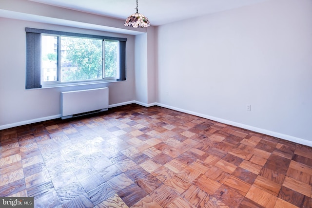 4201 Cathedral Ave NW Unit 1004E, Washington, DC 20016 - unfurnished room with radiator and baseboards