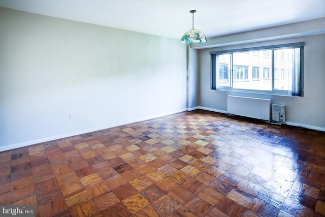 4201 Cathedral Ave NW Unit 1004E, Washington, DC 20016 - empty room featuring radiator and baseboards