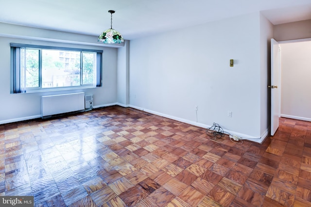 4201 Cathedral Ave NW Unit 1004E, Washington, DC 20016 - empty room with baseboards and radiator heating unit