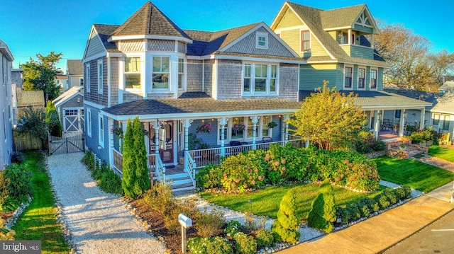 204 Coral St, Beach Haven, NJ 08008 - victorian-style house featuring covered porch, a gate, and fence