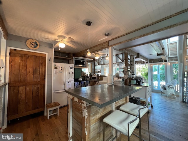 204 Coral St, Beach Haven, NJ 08008 - kitchen with freestanding refrigerator, dark countertops, stainless steel microwave, wood-type flooring, and wooden ceiling