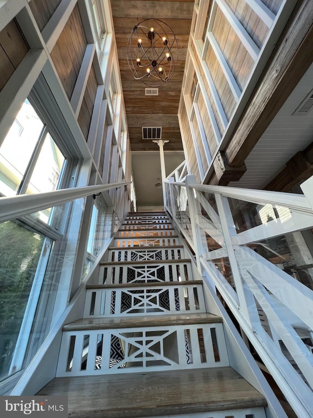 204 Coral St, Beach Haven, NJ 08008 - stairway featuring a chandelier and wood ceiling