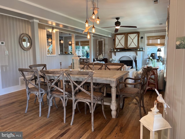 204 Coral St, Beach Haven, NJ 08008 - dining room with a ceiling fan, hardwood / wood-style floors, a fireplace, and ornamental molding