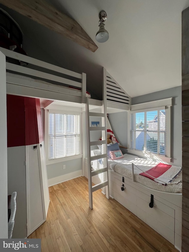 204 Coral St, Beach Haven, NJ 08008 - bedroom with lofted ceiling, light wood-style flooring, multiple windows, baseboards, and fridge