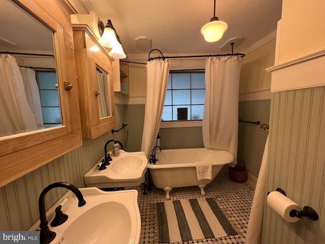 204 Coral St, Beach Haven, NJ 08008 - bathroom featuring a soaking tub and a sink