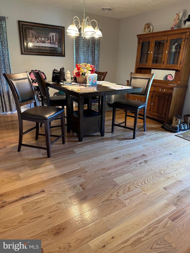 71 Shultz Way, Moorefield, WV 26836 - dining area featuring light wood finished floors and a chandelier
