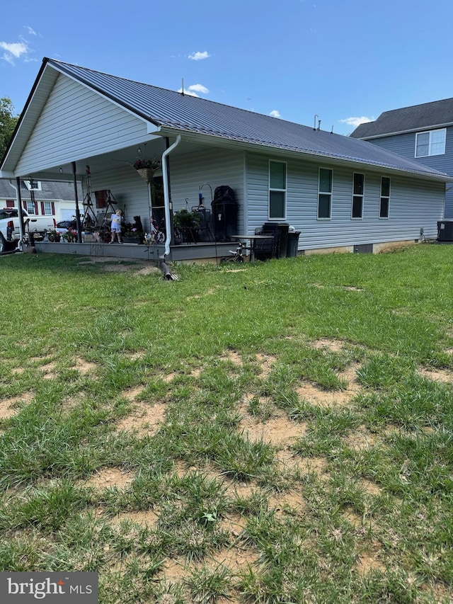 71 Shultz Way, Moorefield, WV 26836 - rear view of property featuring a lawn, metal roof, and central air condition unit