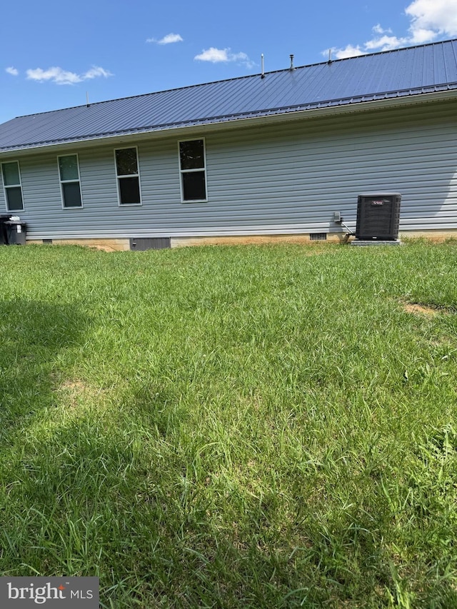 71 Shultz Way, Moorefield, WV 26836 - back of property with central AC, metal roof, a yard, and crawl space