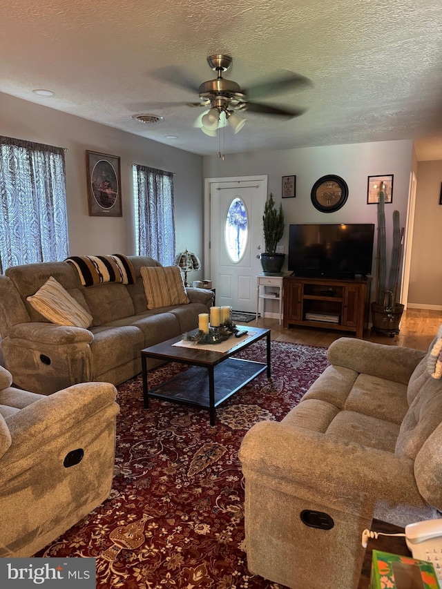 71 Shultz Way, Moorefield, WV 26836 - living area featuring ceiling fan, a textured ceiling, and wood finished floors