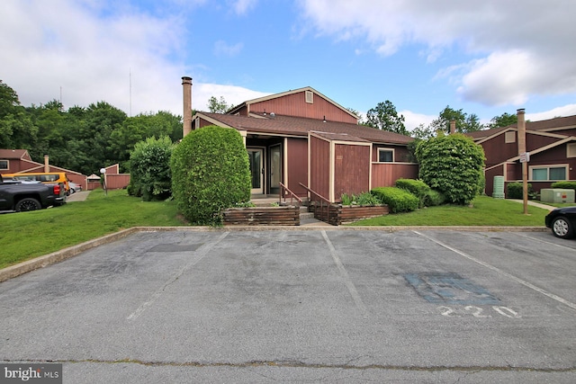220 Brian Dr, Enola, PA 17025 - view of front facade featuring uncovered parking and a front yard