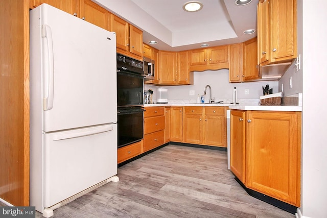 220 Brian Dr, Enola, PA 17025 - kitchen featuring freestanding refrigerator, recessed lighting, light wood-style floors, stainless steel microwave, and light countertops