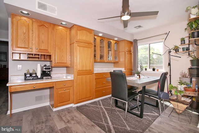 220 Brian Dr, Enola, PA 17025 - kitchen featuring ceiling fan, dark wood-type flooring, light countertops, glass insert cabinets, and open shelves