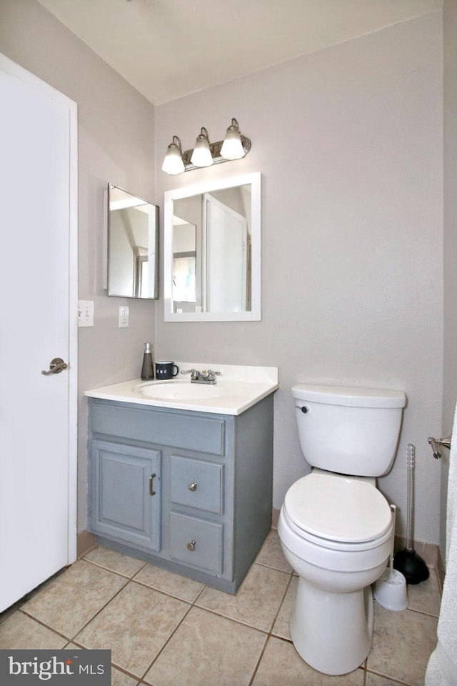 220 Brian Dr, Enola, PA 17025 - bathroom featuring toilet, tile patterned flooring, and vanity