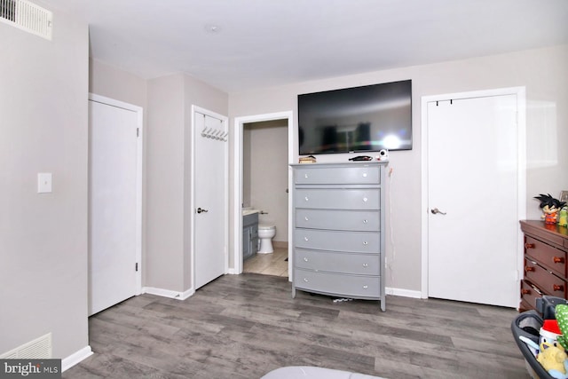 220 Brian Dr, Enola, PA 17025 - bedroom featuring wood finished floors, baseboards, and connected bathroom